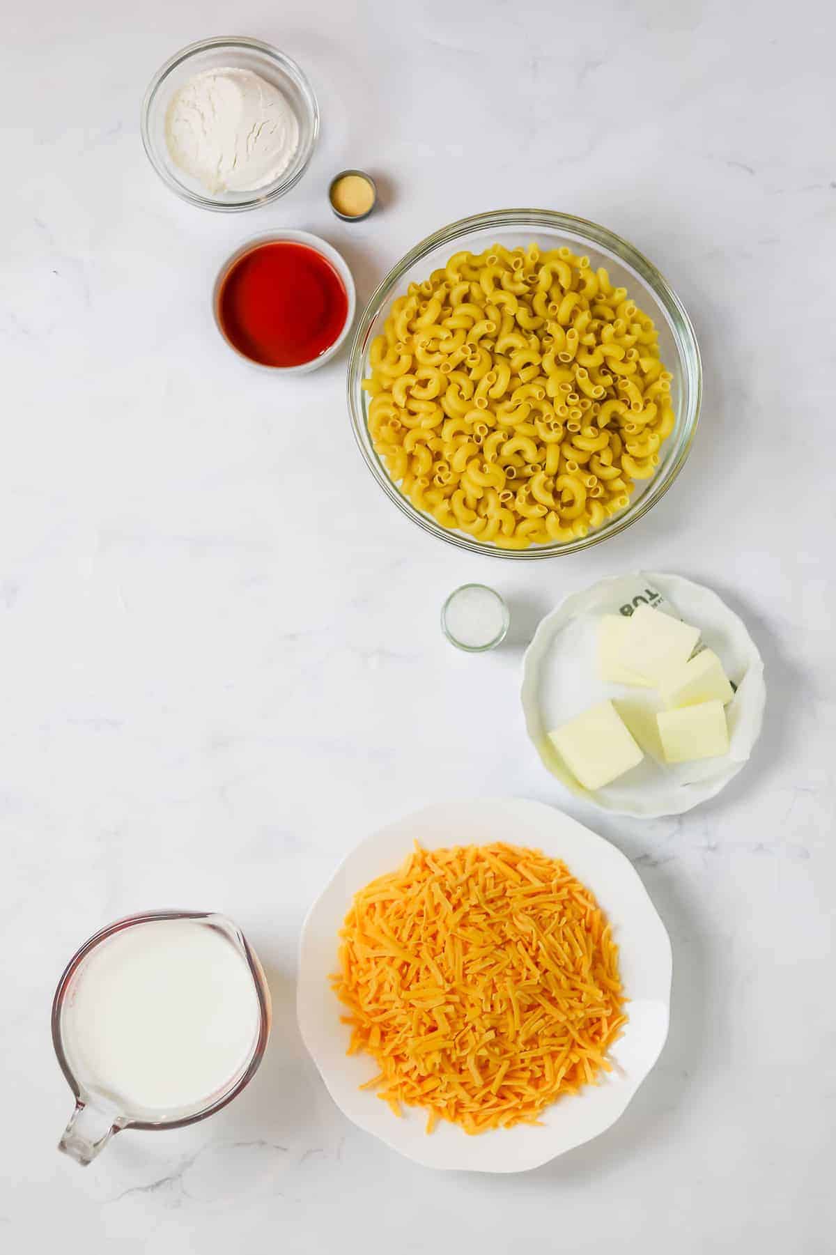 mac and cheese ingredients in bowls, ready to be mixed together.