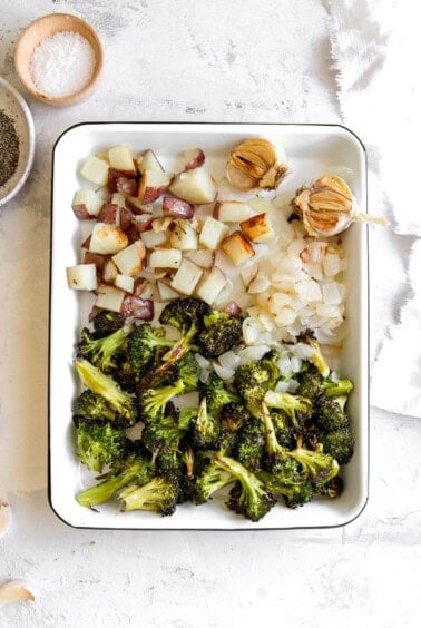 A cheesy baking dish with broccoli and potatoes, flavored with garlic.