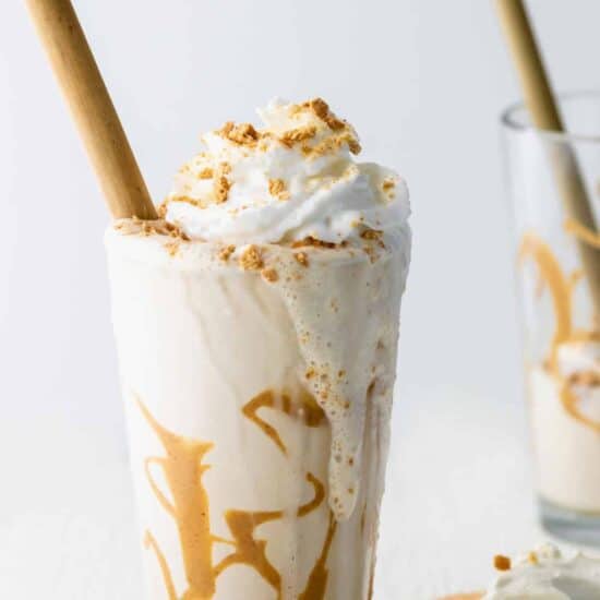 peanut butter cheesecake milkshake topped with whipped cream.