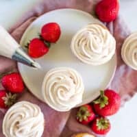 strawberry cream cheese frosted cupcakes on a plate