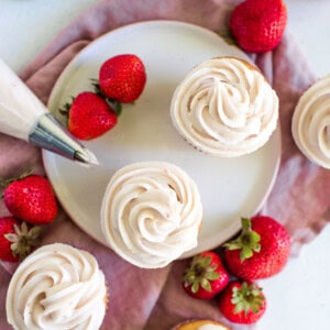 strawberry cream cheese frosted cupcakes on a plate