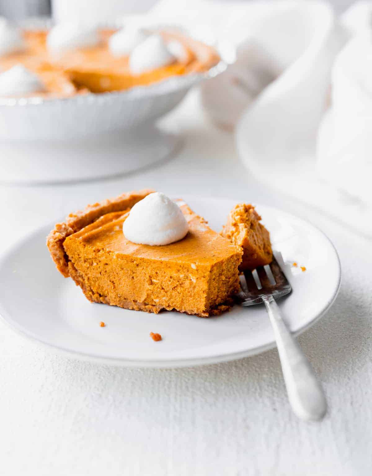 slice of pumpkin cheesecake on a plate