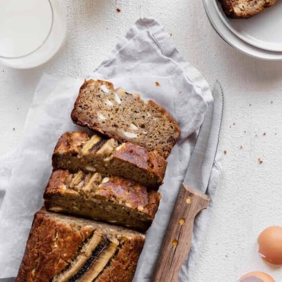 cream cheese banana bread cut up with knife
