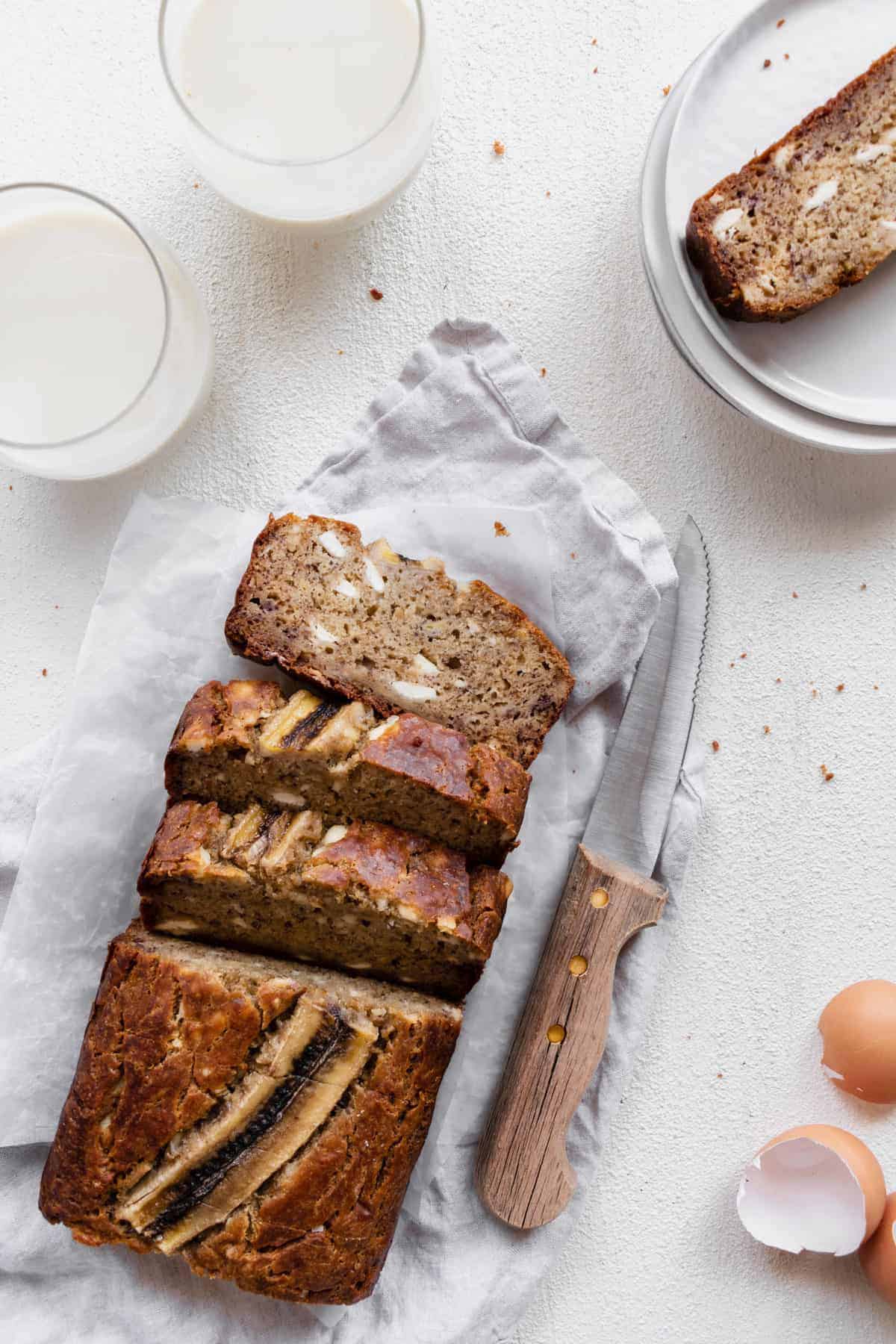 banana bread stuffed with cream cheese sliced on a napkin.