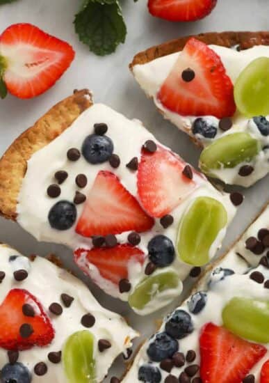 Easy fruit pizza on a cutting board.