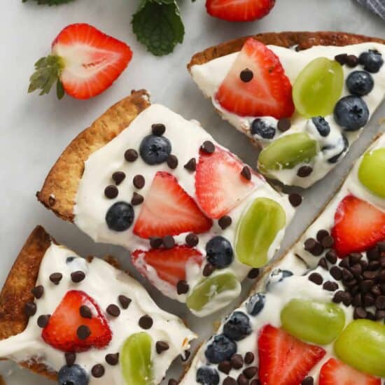 Easy fruit pizza on a cutting board.
