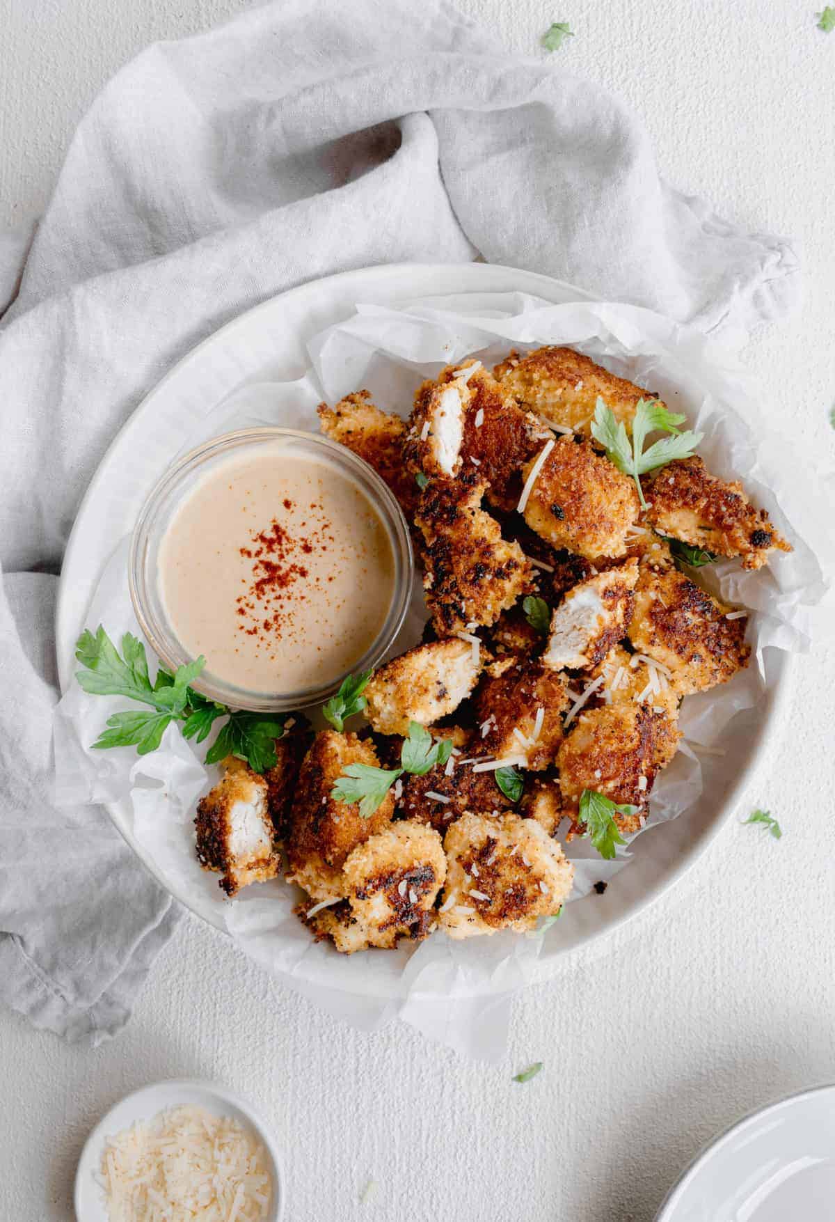 chicken nuggets on plate.