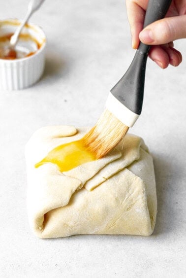 whiping egg wash on puff pastry.