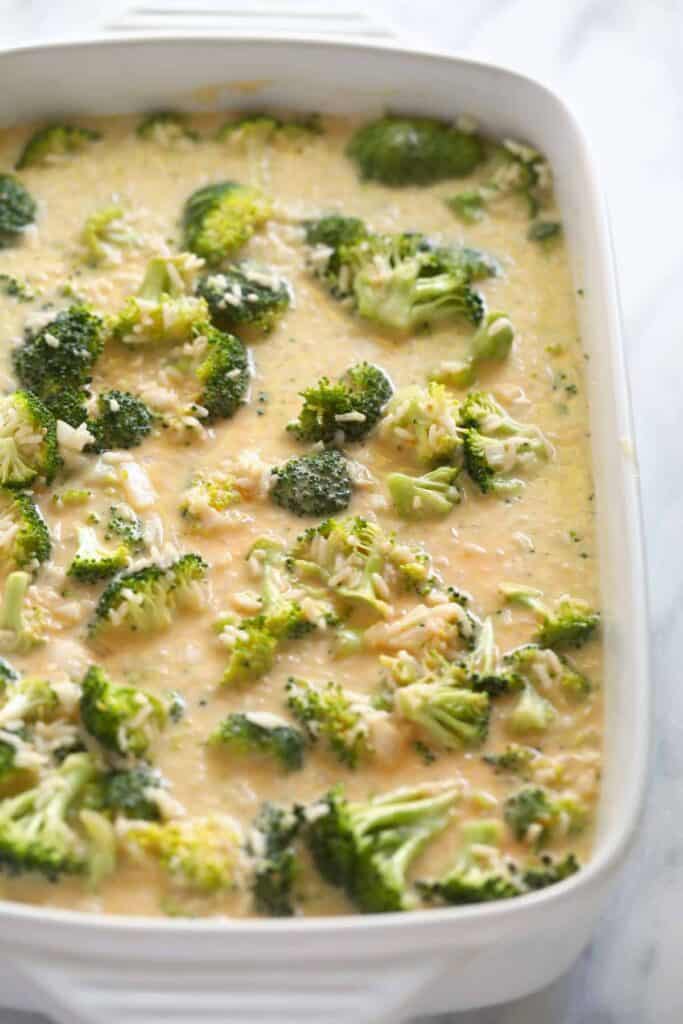 broccoli and cheese ingredients in casserole dish mixed