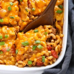 Casserole cut into squares in dish.