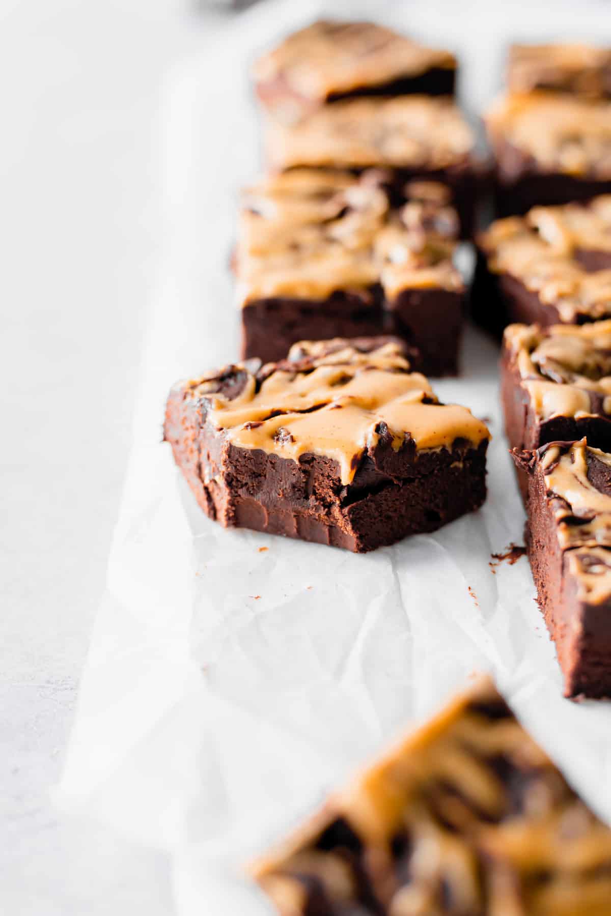 A piece of peanut butter fudge with a bite taken out of it. 