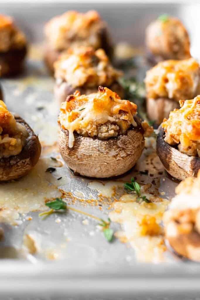 cream cheese stuffed mushrooms on a baking tray