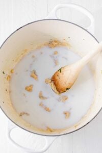 Preparing a roux in a pot.