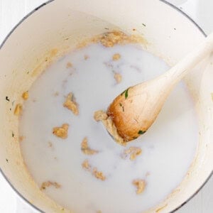 Preparing a roux in a pot.