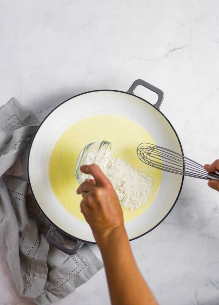 whisking together butter and flour