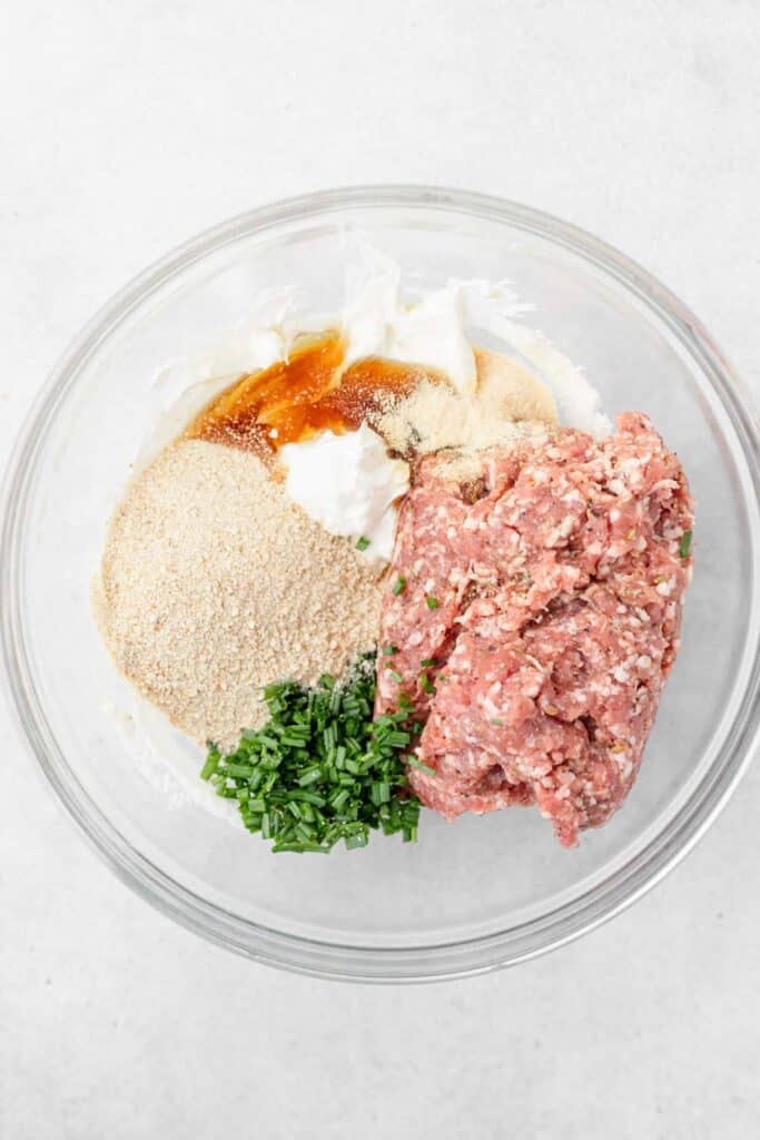 cream cheese sausage ball ingredients in a bowl, ready to be mixed
