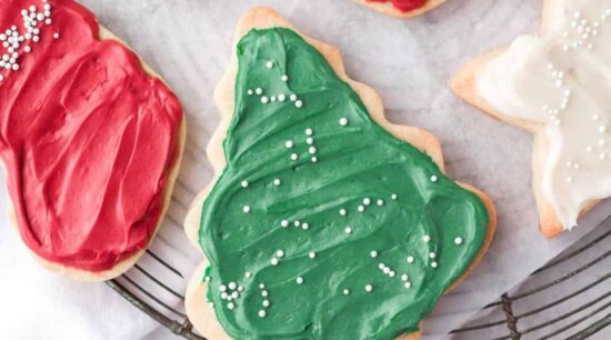 christmas cookies with icing on a cooling rack.