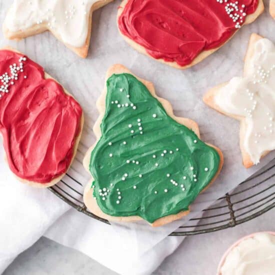 christmas cookies with icing on a cooling rack.