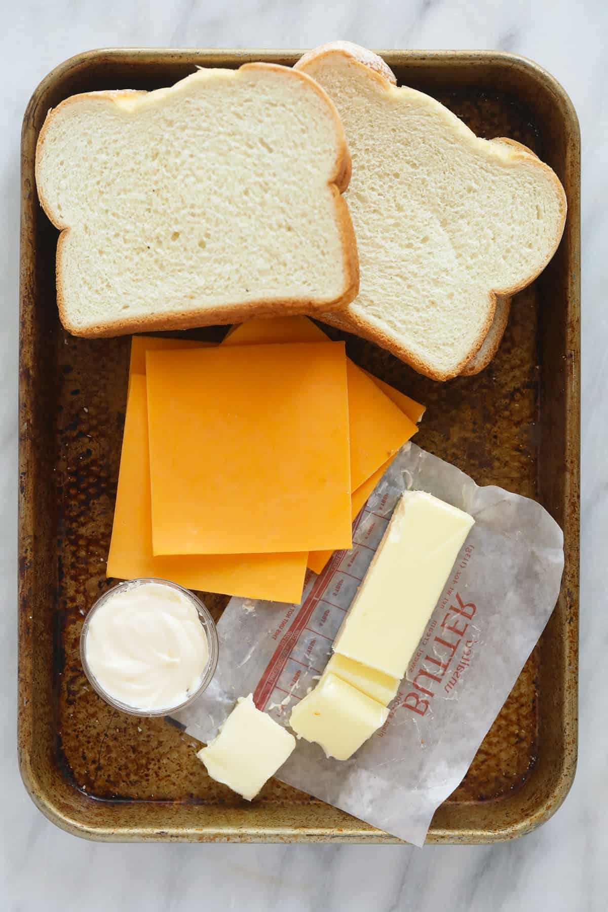 sheet pan grilled cheese ingredients ready to be assembled into sandwiches