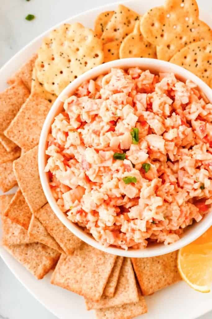 Crab Dip in a bowl surrounded by crackers. 