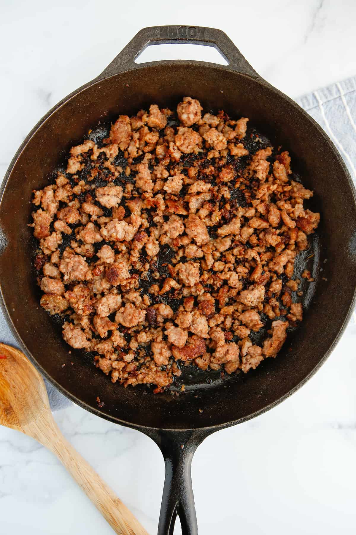 Ground pork in a cast iron. 