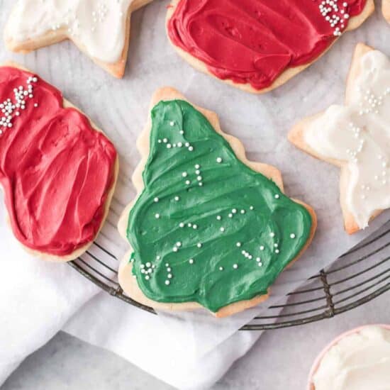 christmas cookies with icing on a cooling rack.