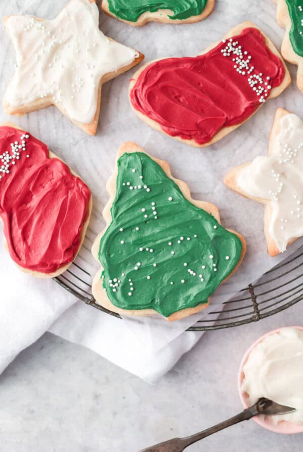 christmas cookies with icing on a cooling rack.
