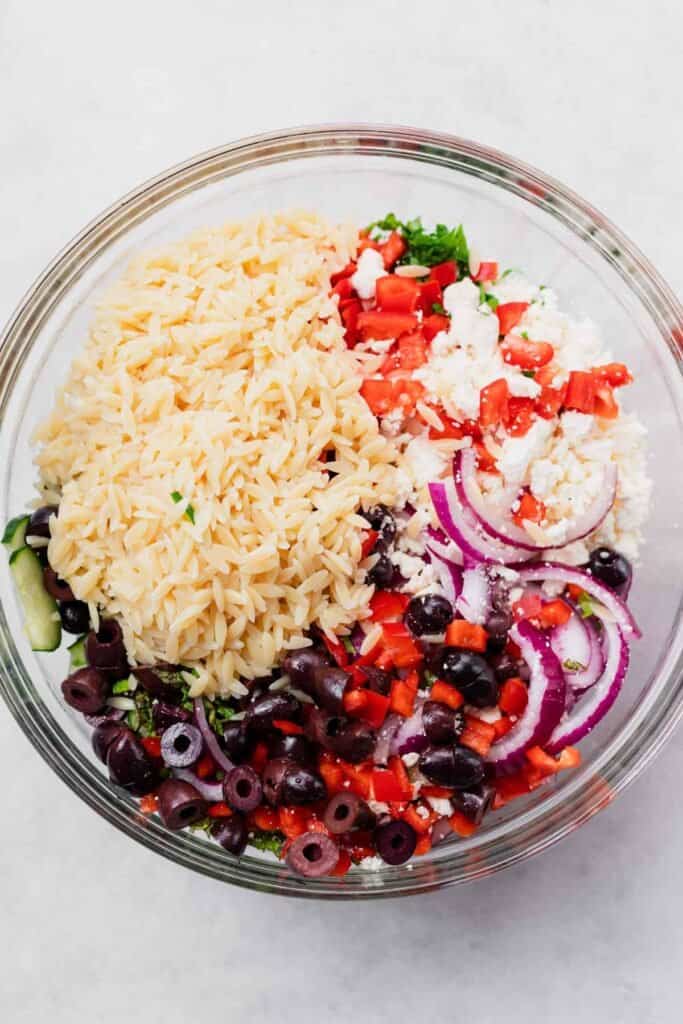 Orzo pasta salad in bowl.