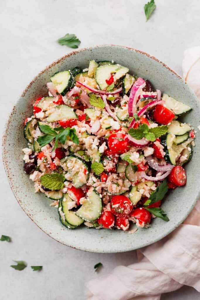 Greek orzo salad in a bowl. 