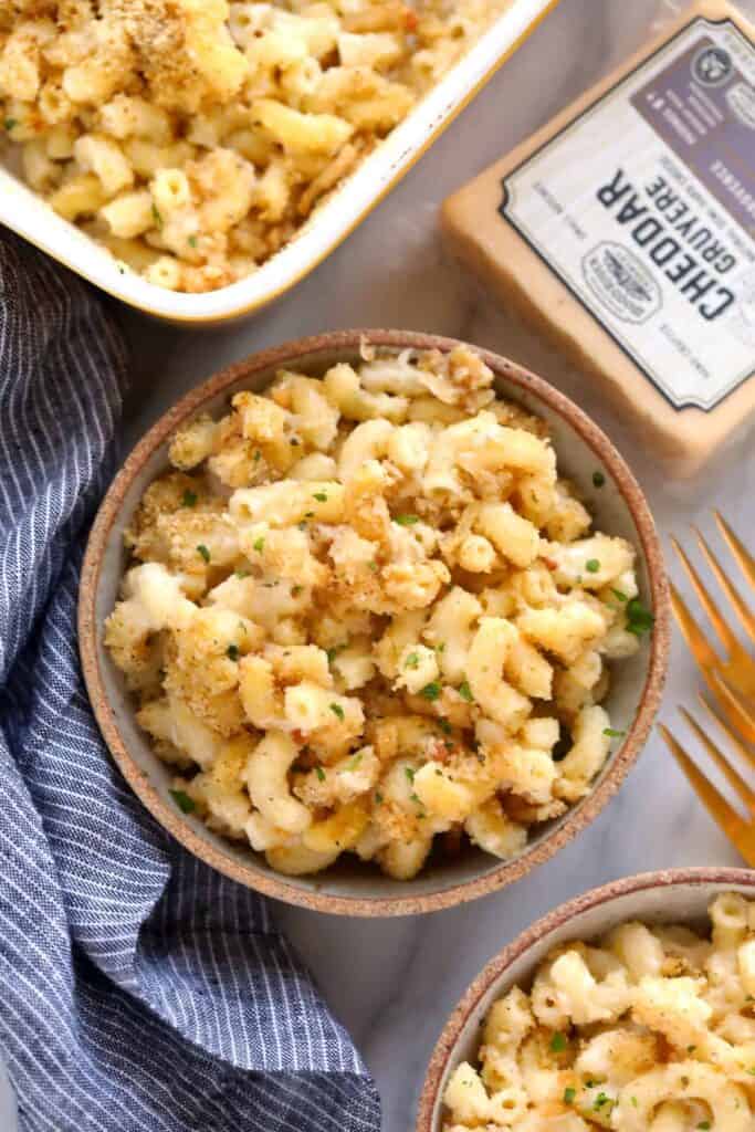 baked mac and cheese in a bowl topped with a delicious breadcrumb topping