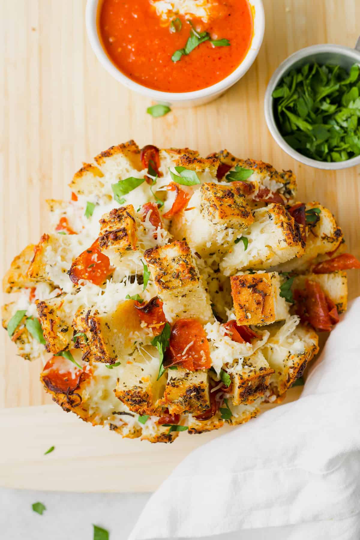 pizza stuffed pull apart bread on cutting board