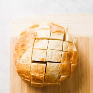 a loaf of bread on a cutting board.