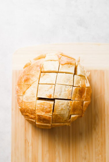 a loaf of bread on a cutting board.
