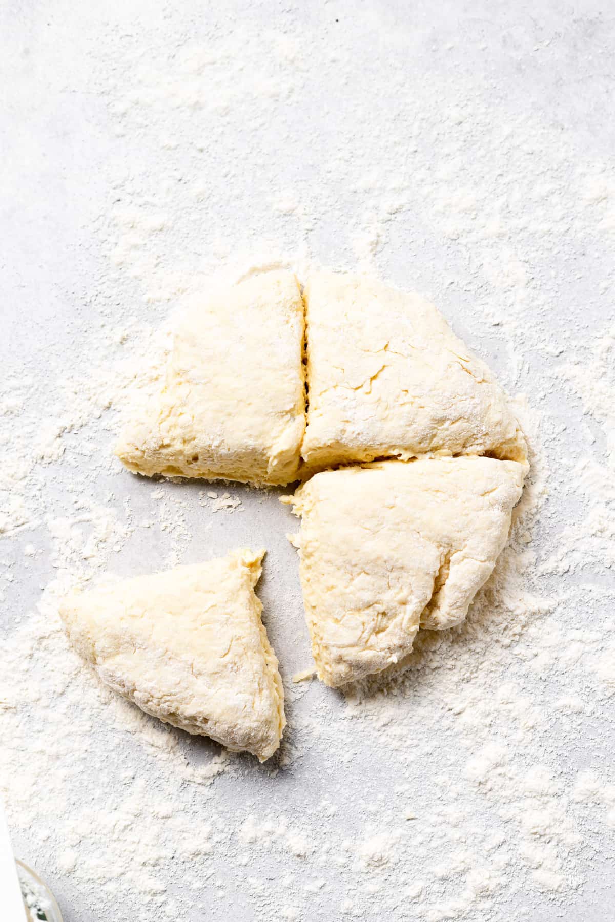 ricotta gnocchi dough split into fourths.