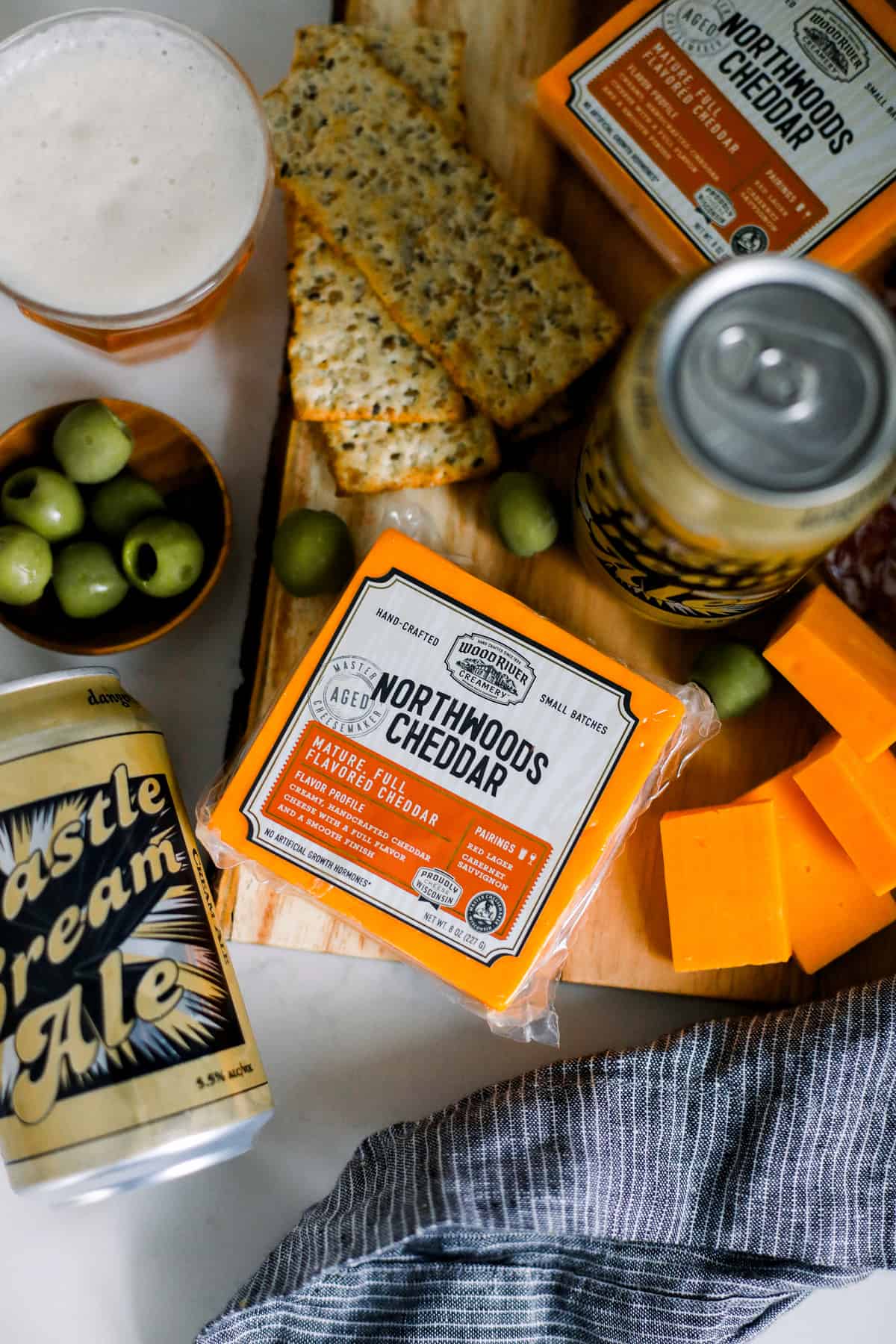 cheddar cheese and olives paired with a delicious cream ale