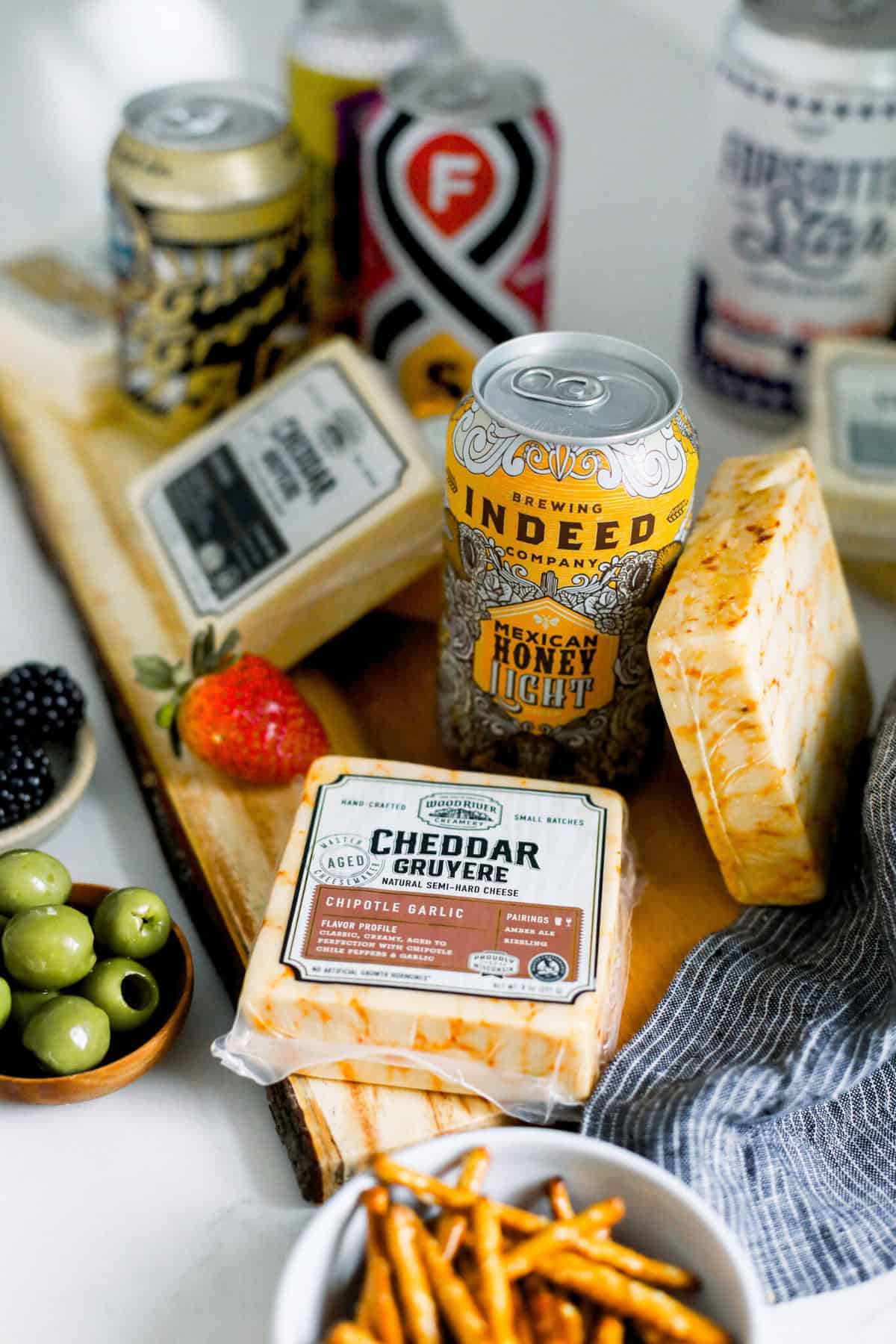 beer and cheese pairings on a cutting board