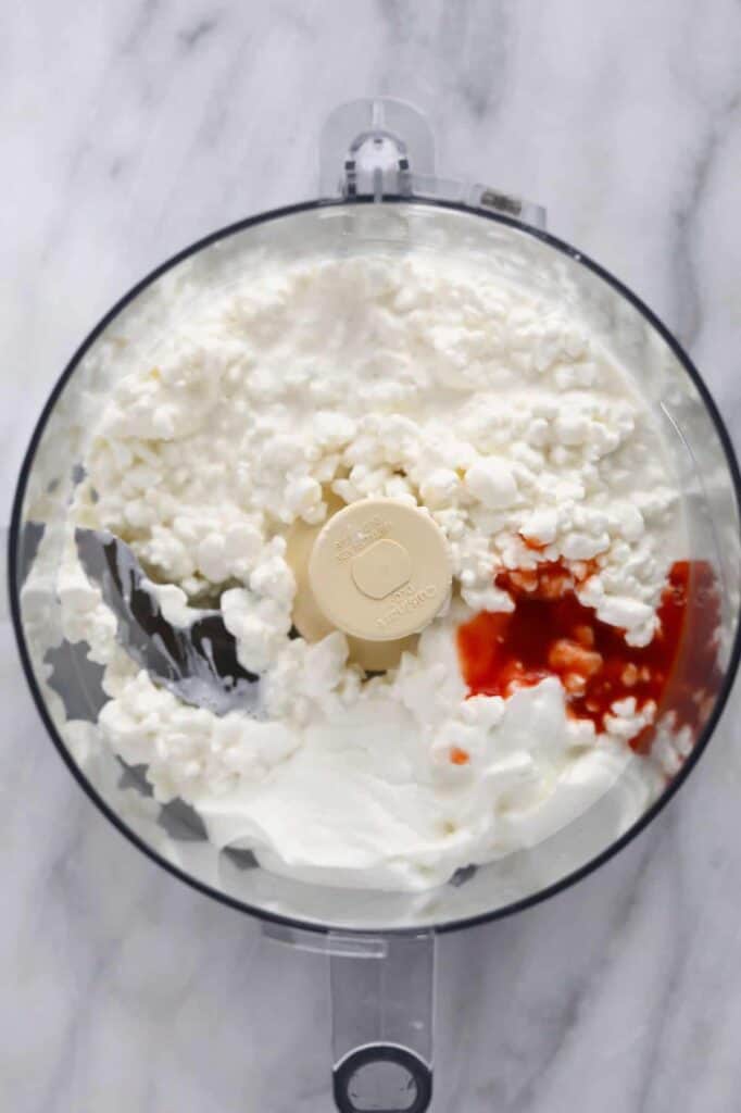 whipped cottage cheese ingredients in a food processor, ready to be whipped to creamy perfection