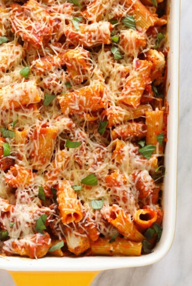 Baked chicken parmesan in a casserole dish.