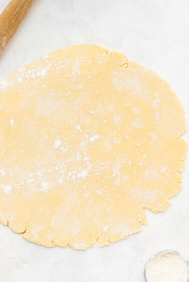 Heart-shaped cookies made with pastry dough and a rolling pin.