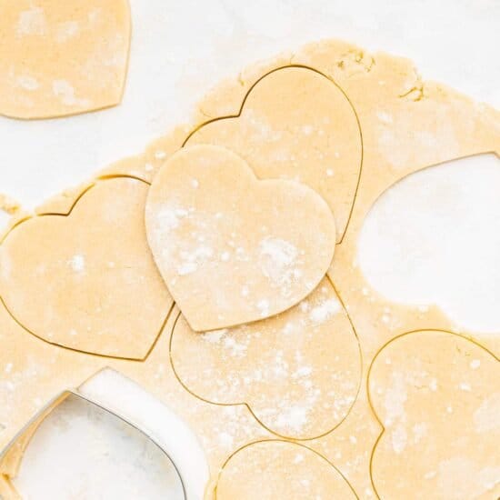 Heart shaped cookie cutters on a white surface.