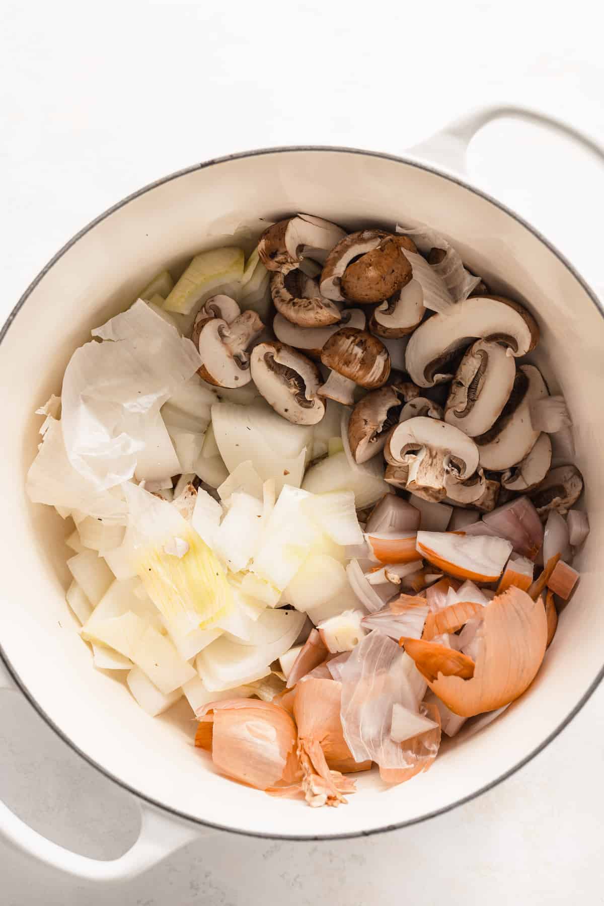 parmesan broth ingredients in a stock pot