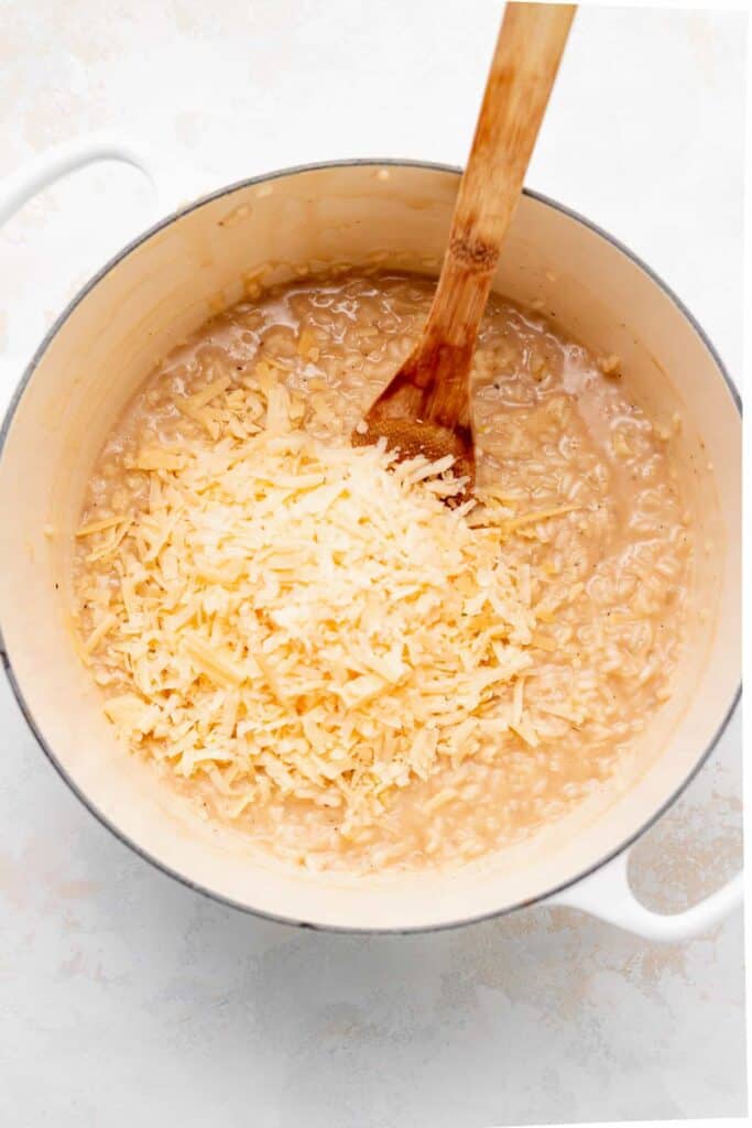 Cooking parmesan risotto in Dutch oven.