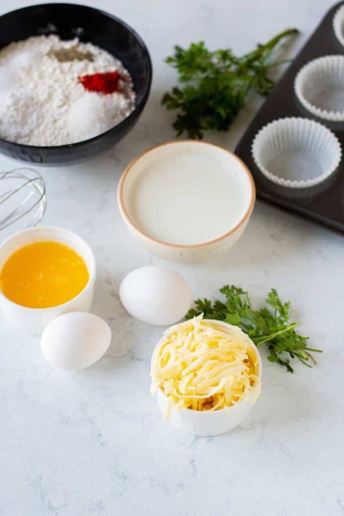 Ingredients for savory cheese muffins ready to be mixed together.