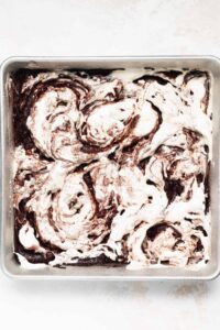 chocolate swirl ice cream in a baking pan.