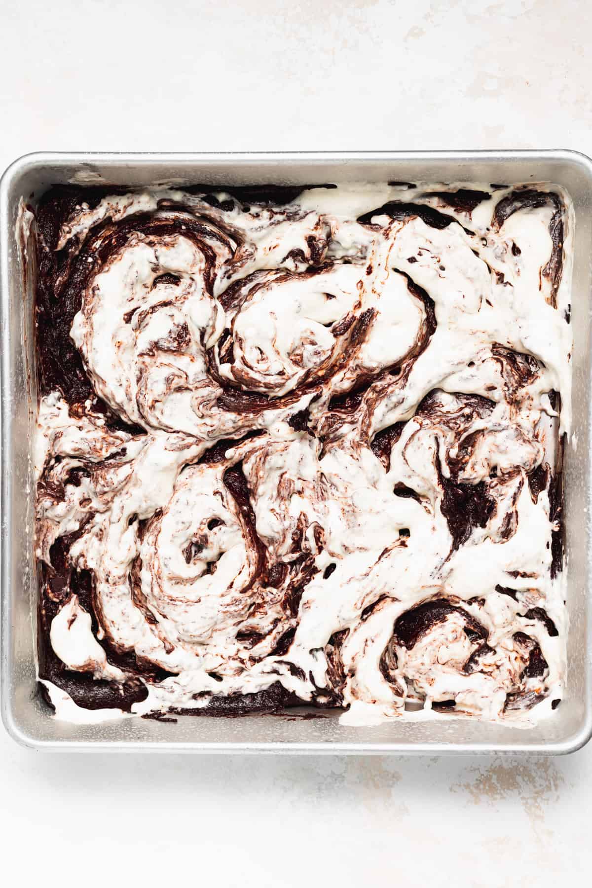 Cream cheese swirl on top of brownie batter. 