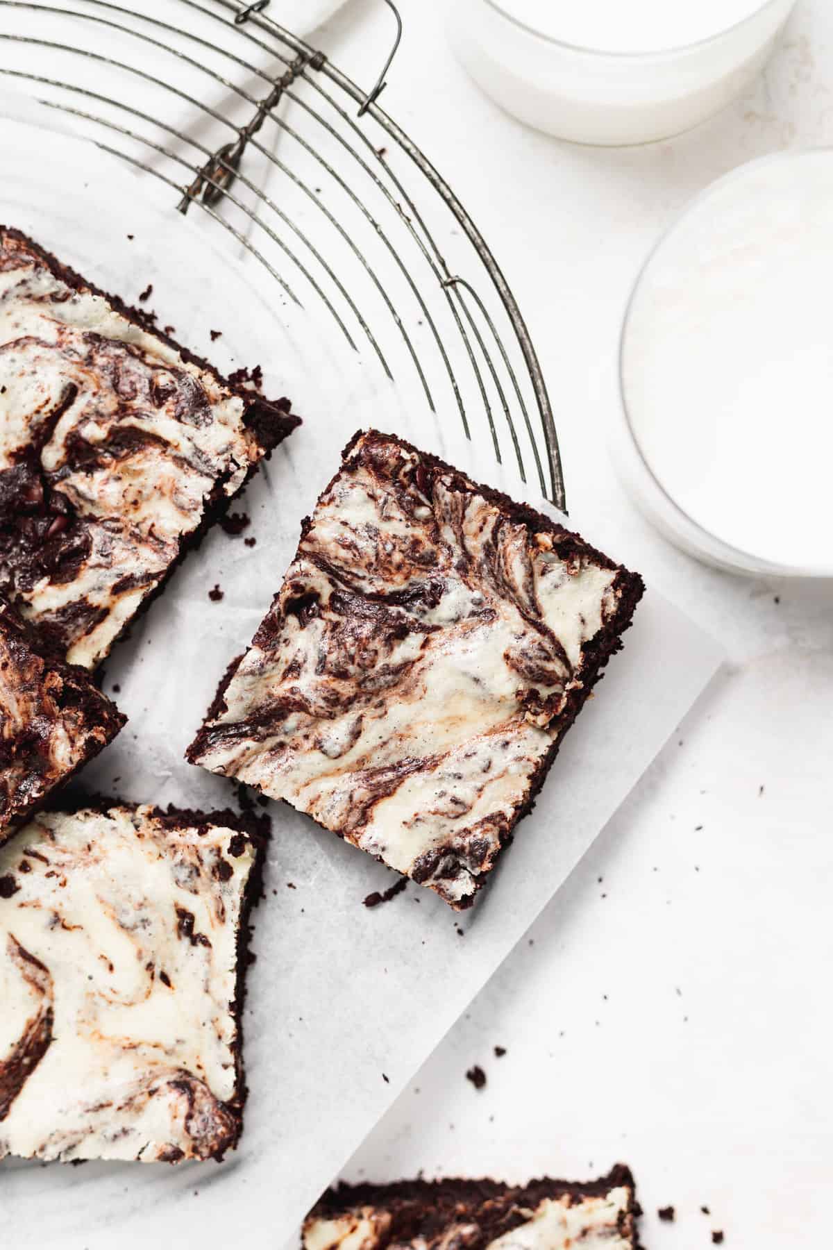 Cream cheese brownies on a cooling rack. 