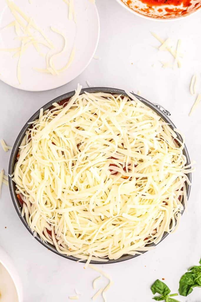 cheese on top of pasta in pan