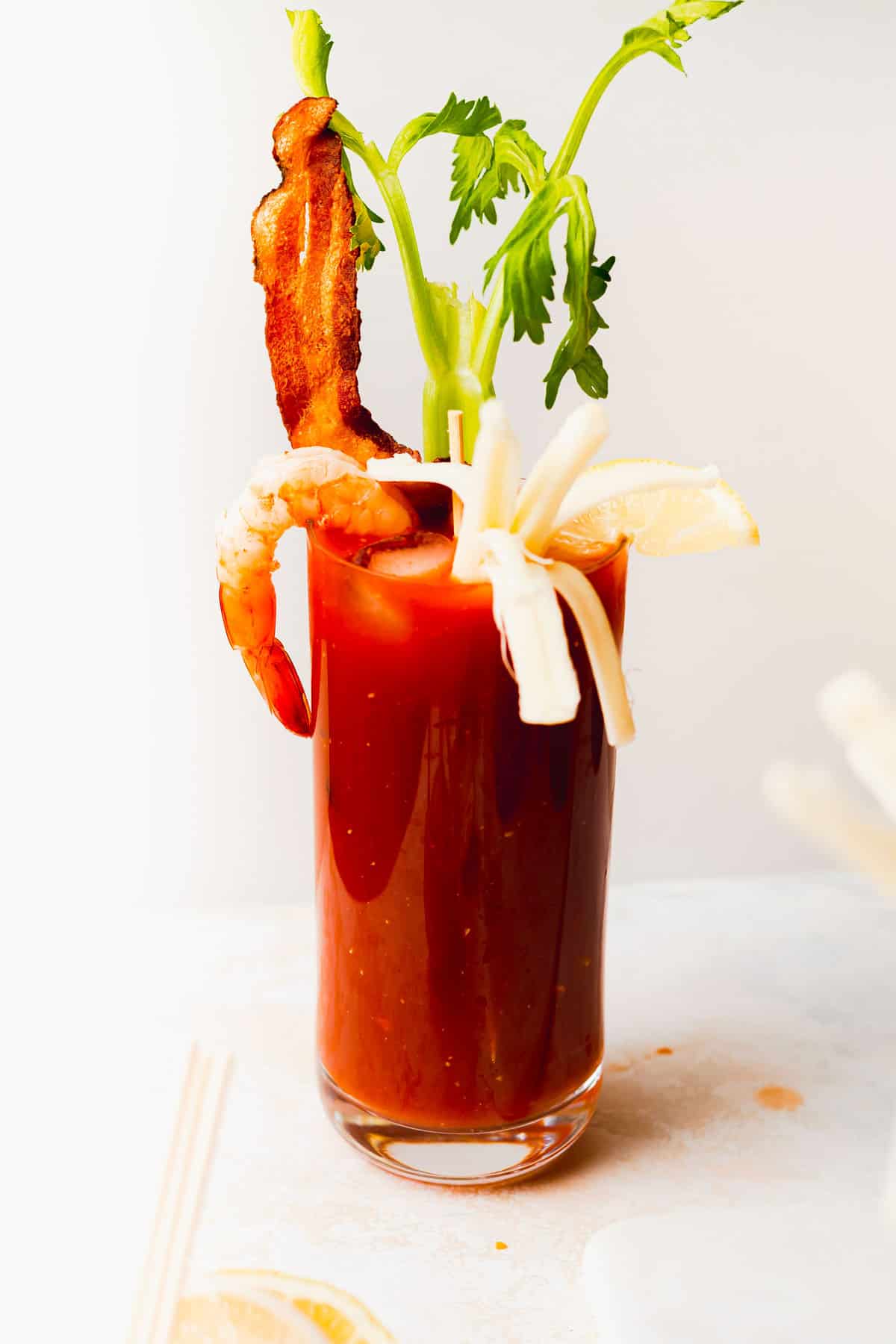 bloody mary in a glass topped with fun accoutrements 