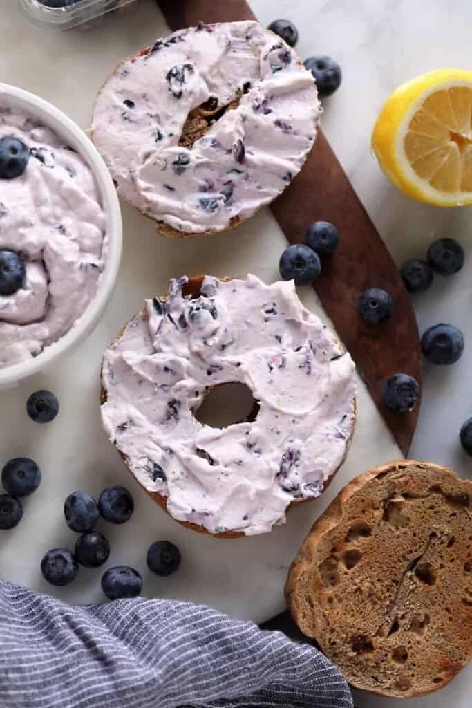 A bagel with blueberry cream cheese. 