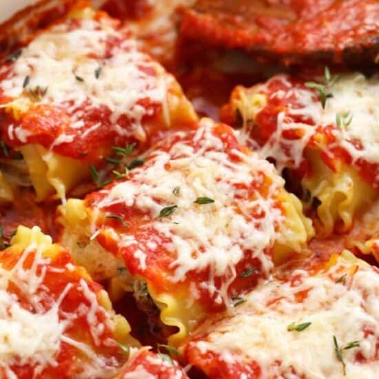 a pan of kale lasagna roll ups